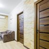 kitchen interior with white furniture with wooden inserts.