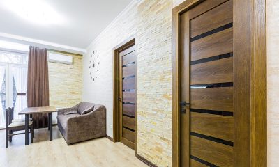 kitchen interior with white furniture with wooden inserts.